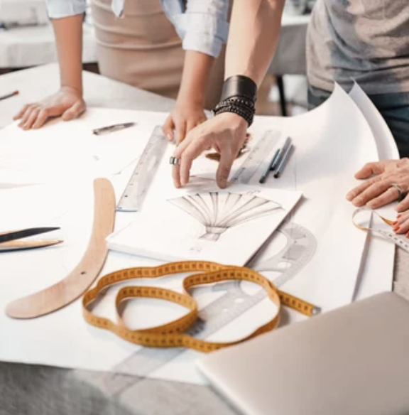 Hands working on sewing machine